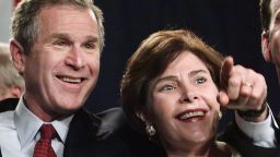 Republican Presidential candidate George W. Bush and his wife Laura wave to supporters during their victory celebration at the Dell Jewish Community Center 14 March 2000i n Austin, Texas. Bush won his party's White House nomination with the sweeping 14 March 2000 primary wins in the US southern states.