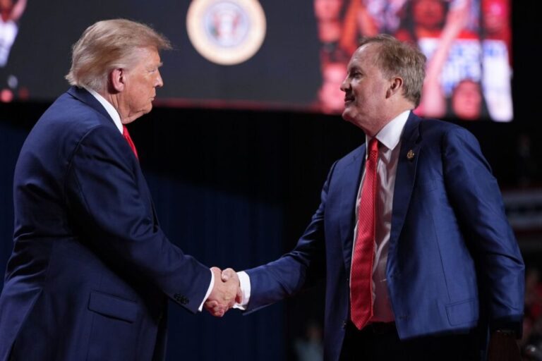 President Donald Trump greets Texas Attorney General Ken Paxton at a campaign rally at the Freeman Coliseum in San Antonio, on Wednesday.