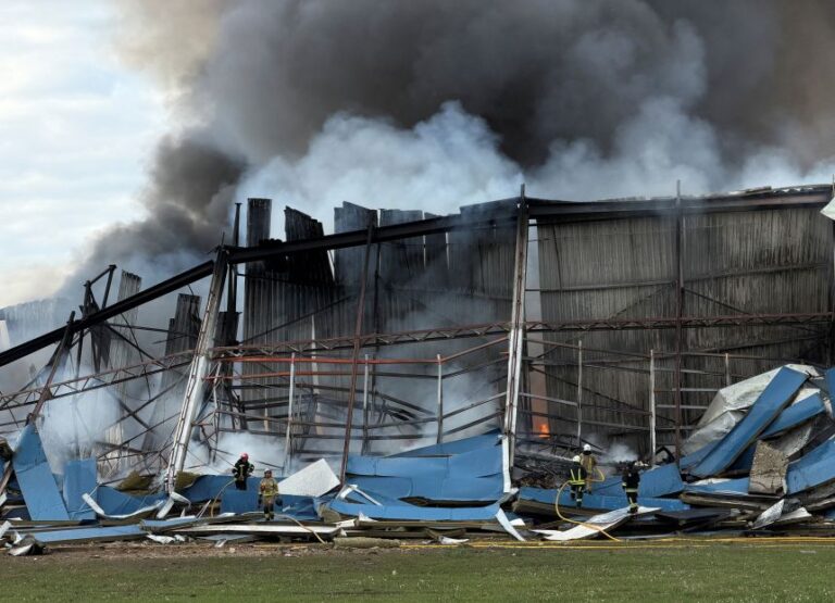 Firefighters work at the site of a warehouse, used by McDonald's, that was hit by a Russian drone strike, amid Russia's attack on Ukraine in Kyiv region, Ukraine, on September 25, 2026.