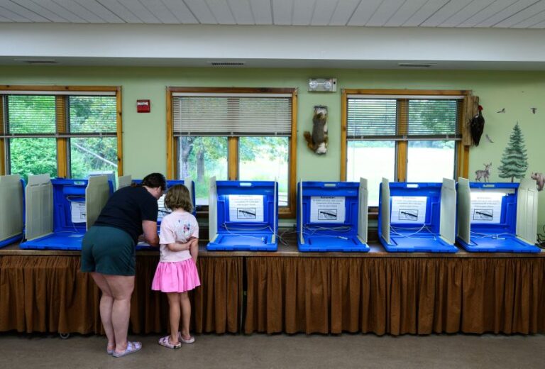 A voter fills out their ballot at a polling place in White Bear Township, Minnesota, during the primary election on August 11.