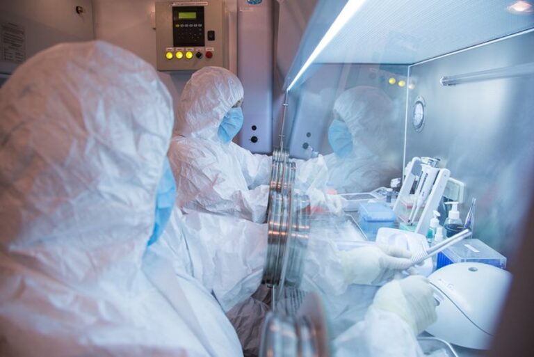 This undated photo released in 2019 by the Irkutsk Anti-Plague Research Institute of Siberia and Far East shows institute workers in a lab.