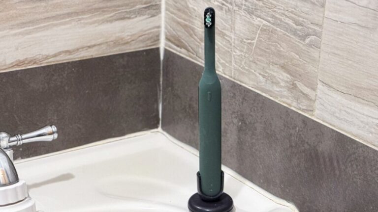 Quip Ultra Next Generation Smart Sonic Toothbrush on bathroom sink.