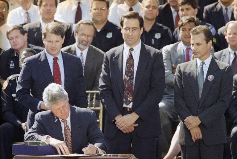 President Bill Clinton signs the $30 billion crime bill during a ceremony on the South Lawn of the White House on September. 13, 1994.