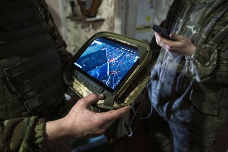 Accurate timekeeping underpins satellite navigation. A Ukrainian soldier checks a military GPS tracker near the frontline area amid the Russia-Ukraine war, in Bakhmut, Ukraine, in April 2023.
