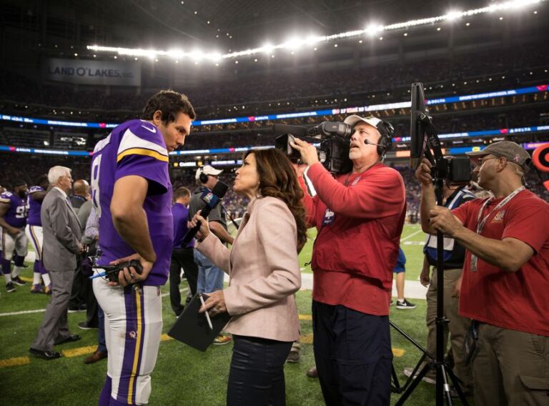 Michele Tafoya interviews Minnesota Vikings quarterback Sam Bradford on the sidelines of a pre-season game, at US Bank Stadium in Minneapolis, on August 28, 2017.