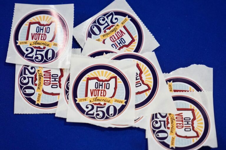 Voters receive stickers at early in-person voting in Cleveland on Wednesday, October 7, 2026.