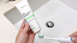 Boka toothpaste being applied to a toothbrush