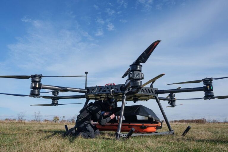 A representative of the SkyFall drone company climbs into a medical module of the StarGate drone before a demonstration flight at an undisclosed location in Ukraine, on Wednesday, October 14.