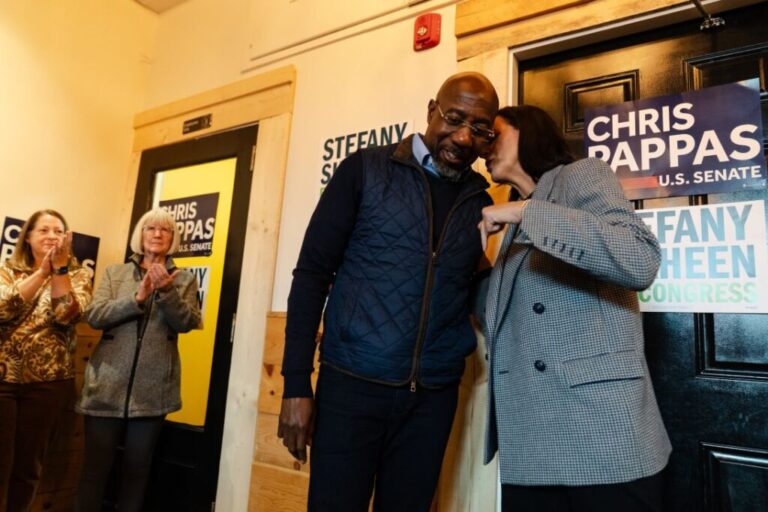 Sen. Raphael Warnock and House candidate Stefany Shaheen speak during a meet-and-greet in Portsmouth, New Hampshire, on October 6.