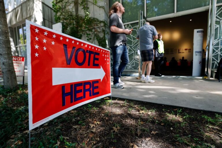 People arrive at a polling location during early voting in the midterm election, in Atlanta, Georgia, on October 13, 2026.