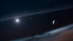 This artist’s concept depicts the young Beta Pictoris planetary system with the newly discovered giant exoplanet; Beta Pictoris d; at the right. Beta Pictoris c circles closest to the star (left in this artist’s concept); Beta Pictoris b follows on a wider orbit; and the newly discovered Beta Pictoris d lies farther out; just inside the debris disk’s inner edge. In this artist’s concept; the planets are shown at their correct relative orbital distances; but the planets themselves have been enlarged and are not to scale relative to their orbits.