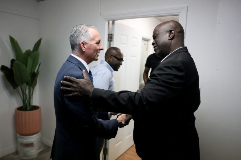 Florida Democratic gubernatorial candidate David Jolly greets State Rep. Wallace Aristide as he opens a campaign field office on in Miami Gardens, on September 23.
