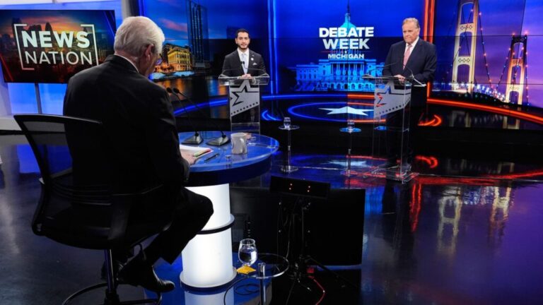 Moderator and political reporter Rick Albin, left, questions Democratic nominee for U.S. Senate Abdul El-Sayed, center, and Republican nominee for U.S. Senate Mike Rogers, right, during a televised debate at WOOD-TV, on Thursday, Oct. 8, 2026, in Grand Rapids, Mich. (AP Photo/Paul Sancya, Pool)