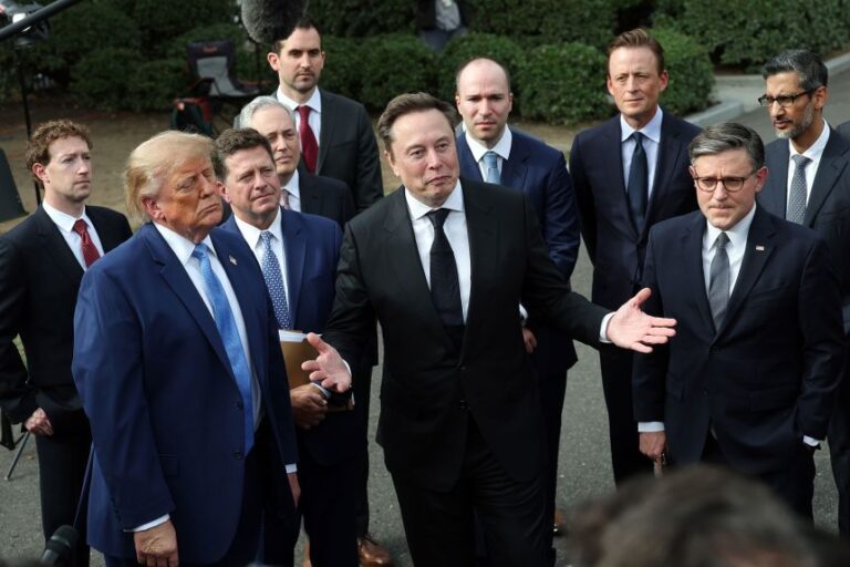 Elon Musk stands with President Trump and others following a meeting on artificial intelligence, outside the White House in September.