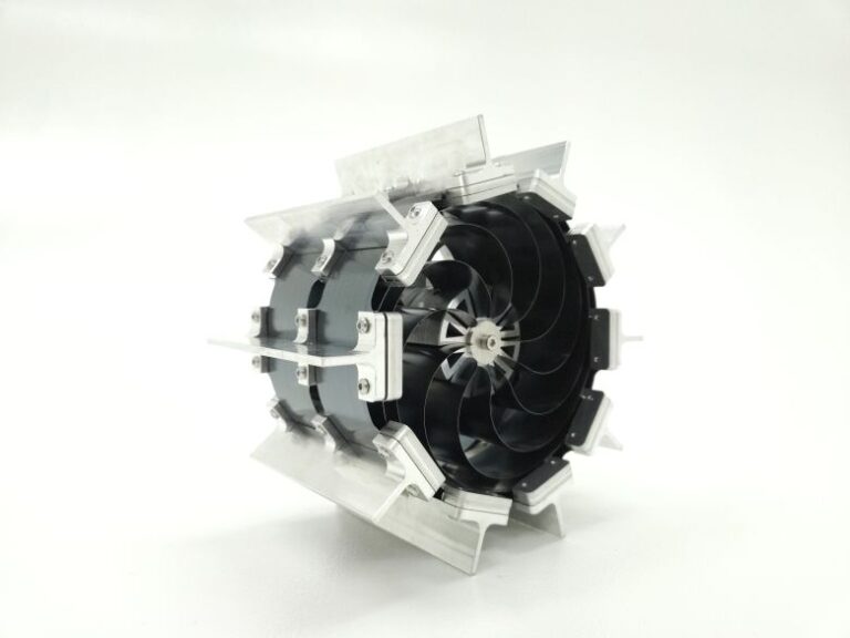 The wheel is composed of elastic metal strips arranged in a spiral configuration that allows it to deform while maintaining high strength.