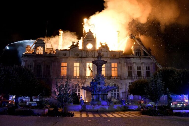 This photograph shows a fire burning and destroying the city hall after a group of individuals forced entry into the building in Limoges on Saturday.