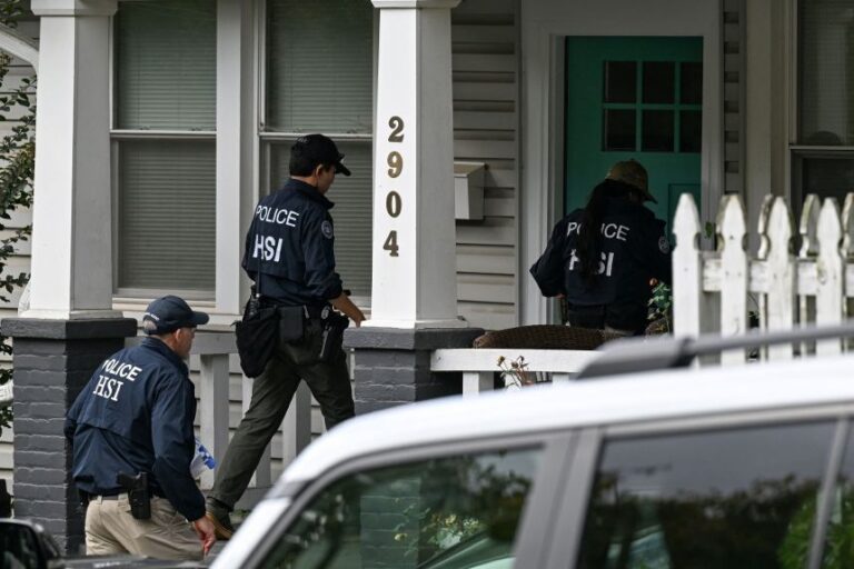 Homeland Security officers work at the Washington, DC, home of US Rep. Ilhan Omar during a search there on Monday.