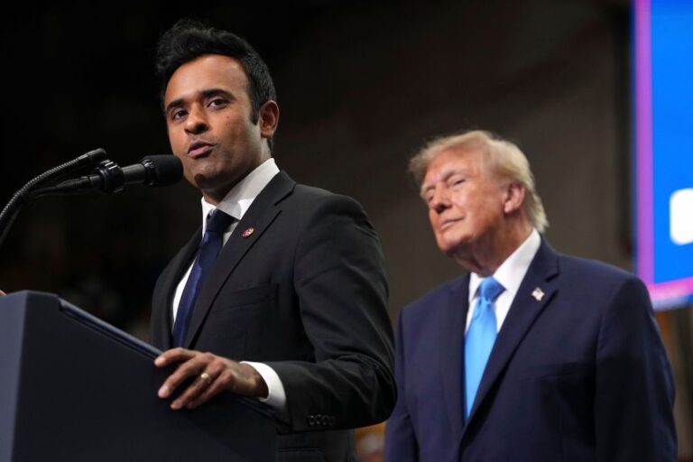 Ohio Republican gubernatorial candidate Vivek Ramaswamy speaks as President Donald Trump listens during an event in Vandalia, Ohio, on October 3.