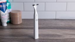 Slate Electric Flosser on bathroom counter