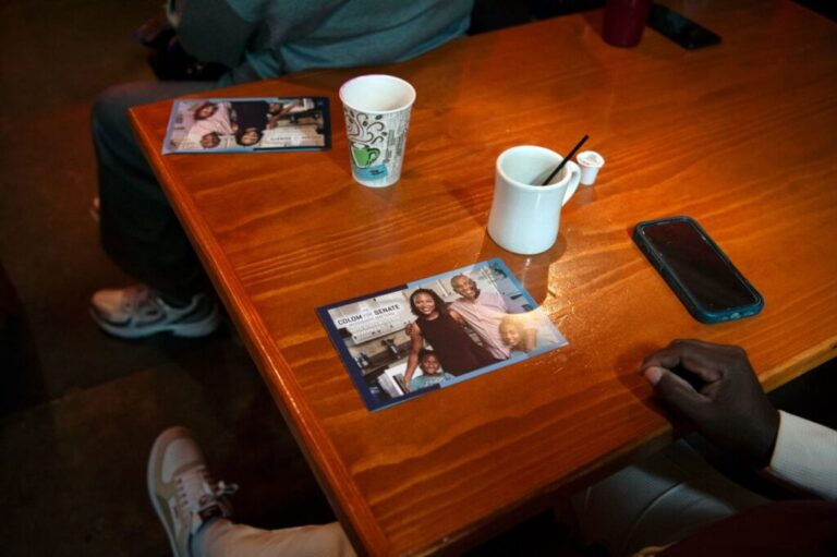 Campaign postcards remain on the table during a Scott Colom postcard party at the Apothecary at Brent's Drugs in Jackson on Saturday.