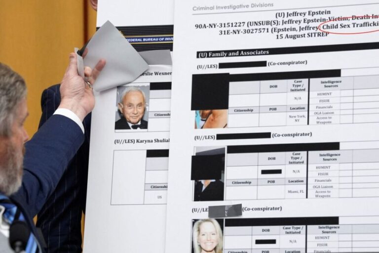 Rep. Thomas Massie lifts a piece of paper on a board displaying a FBI document, revealing an image of businessman Les Wexner, during a House Judiciary Committee hearing on February 11.