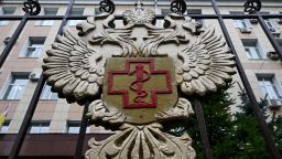 The logo of Rospotrebnadzor, the Russian agency that handles infectious disease, sits on the fencing of its grounds in Moscow on Monday.