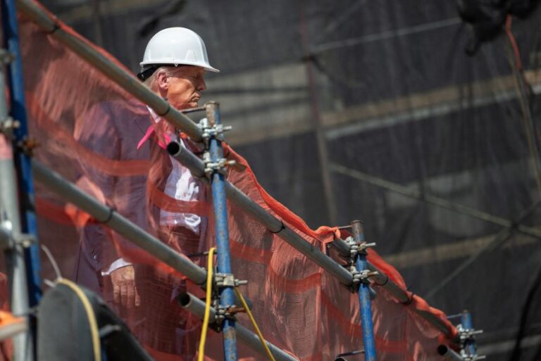 President Donald Trump looks over the construction site as he visits the Federal Reserve in Washington, DC, on July 24, 2025.