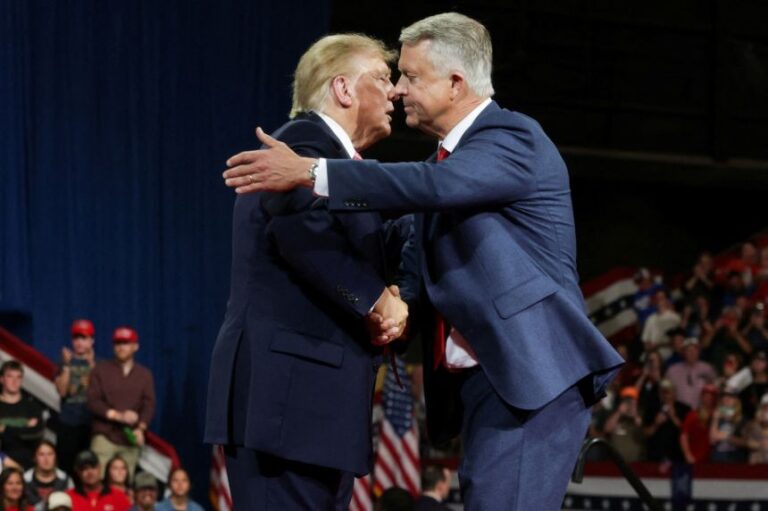 President Donald Trump and Sen. Roger Marshall greet each other during a rally in Park City, Kansas, on Monday.
