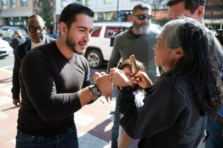 El-Sayed greets supporters who were not able to attend his campaign event after it reached maximum capacity at the State Theater in Traverse City, Michigan, on October 10.