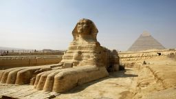 The Great Sphinx of Giza, a large half-human, half-lion Sphinx statue on the Giza Plateau on the west bank of the Nile River, near modern-day Cairo seen with the Chephren (Khafre) Pyramid in the background, 23 October 2007. The Great Sphinx is one of the largest single-stone statues on Earth, and is commonly believed to have been built by ancient Egyptians in the 3rd millennium BC, somewhere between 2520 BC and 2494 BC. The debate surrounding the real-life model used for the face when it was built, and by whom, have earned the title