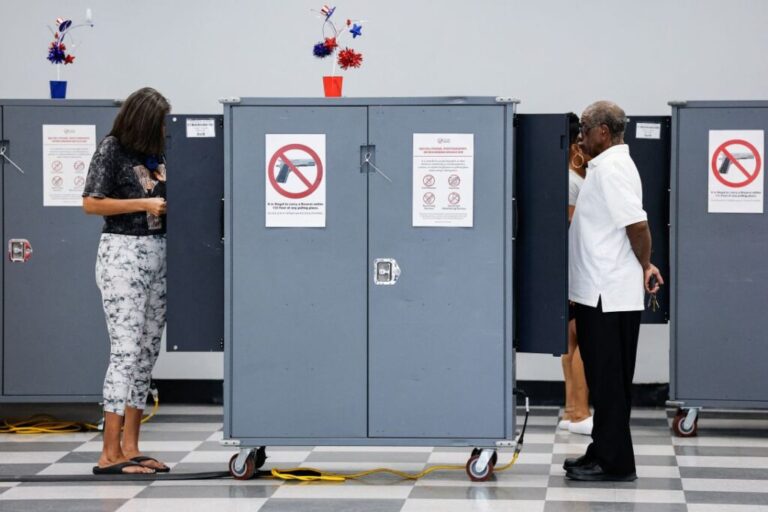 People cast their ballots during early voting in Atlanta on October 13.
