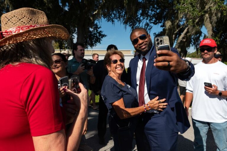 Representative Byron Donalds, a Republican from Florida and gubernatorial candidate, takes a photo with an attendee during a campaign event in Lakeland, on Thursday, Oct. 1.