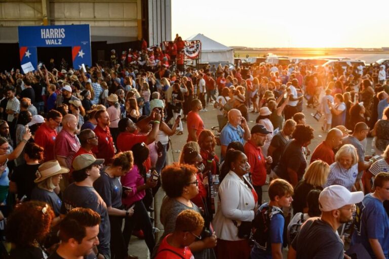 Attendees begin to exit the Signature Aviation Hanger as Vice President Kamala Harris and Governor Tim Walz's presidential campaign rally at Detroit Metropolitan Wayne County Airport in Romulus, Michigan on August 7, 2024 concludes.